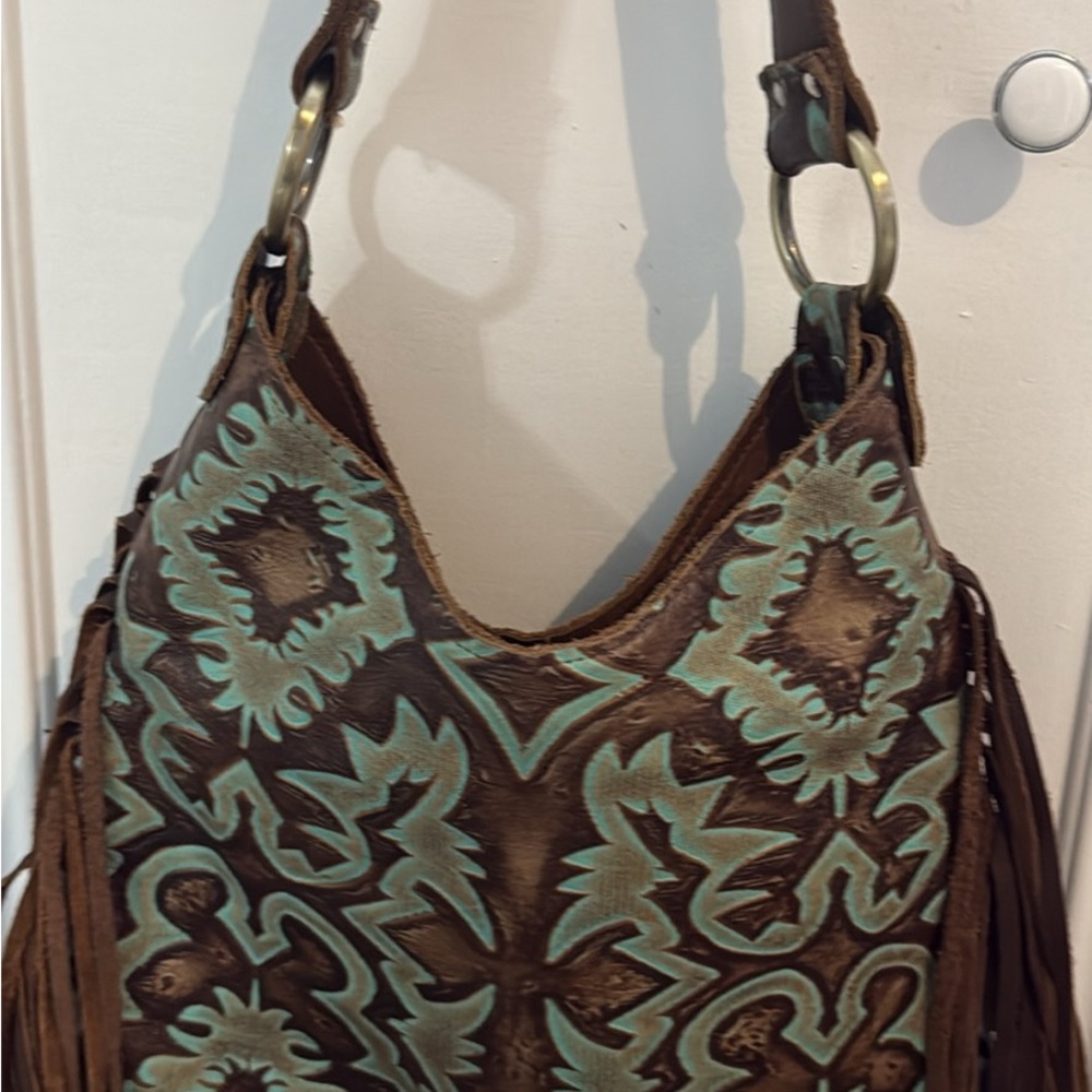 Raviani leather hand tooled western style with fringe shoulder bag.